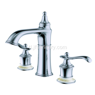 Brass basin mixer dual handle.